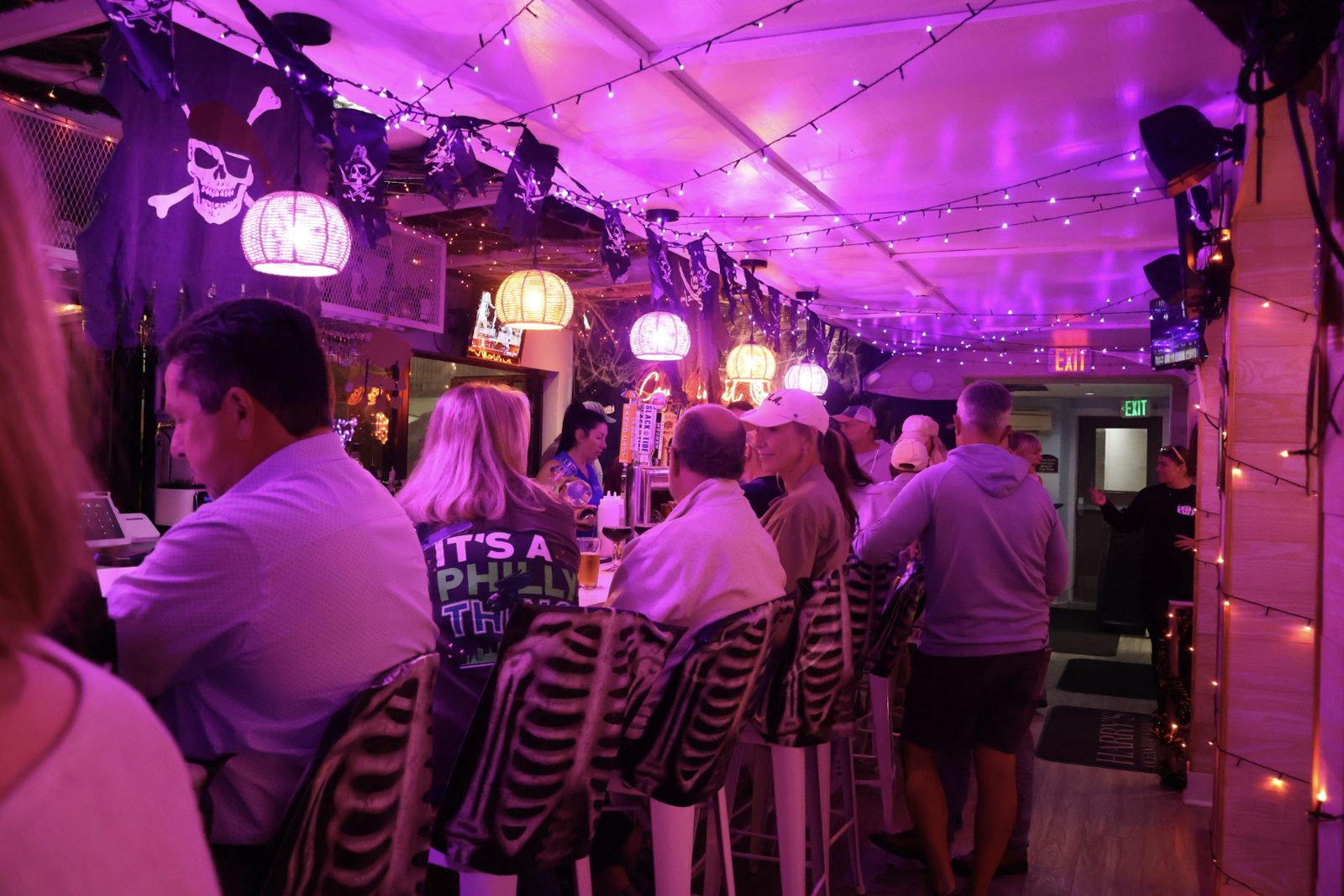 Guests at the purple-lit Boo Bar at Harry's Cape May